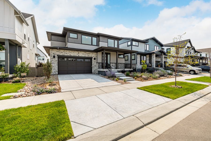 Front exterior of a new home in West Grange, Longmont, CO, highlighting curb appeal (Image 22).
