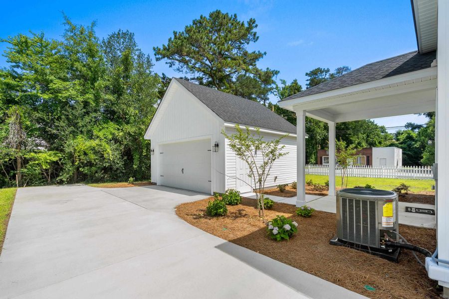 Exterior details and patio area of a home in Downtown Loris Homes, Loris (Image 28).