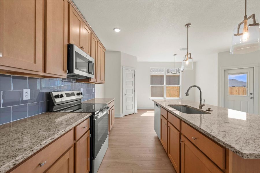 Please Note: These interior photos are not of the actual home but are of a completed one with a simialr floor plan. Finishes, features, and layouts may vary.