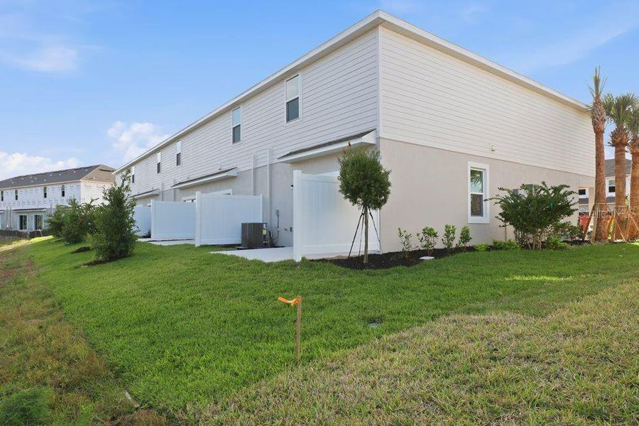 Exterior details and patio area of a home in The Towns at Firethorn, Parrish (Image 30).