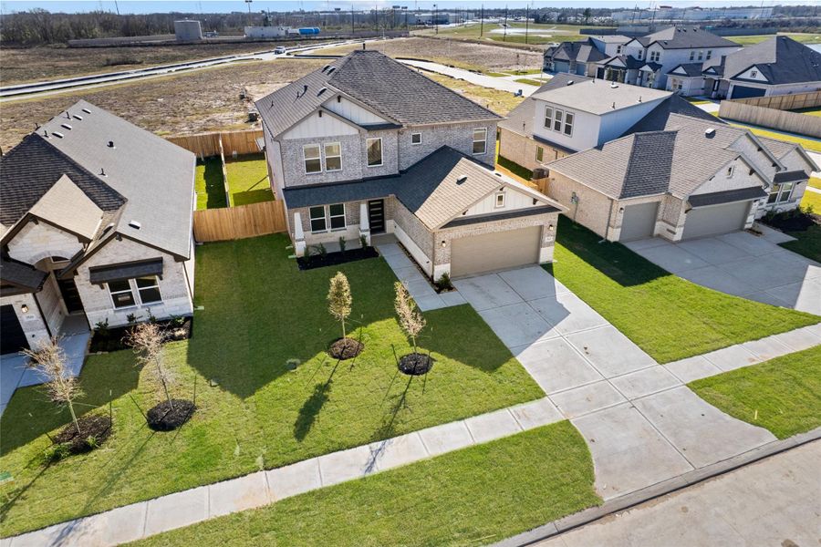 Front exterior of a new home in , Manvel, TX, highlighting curb appeal (Image 22).