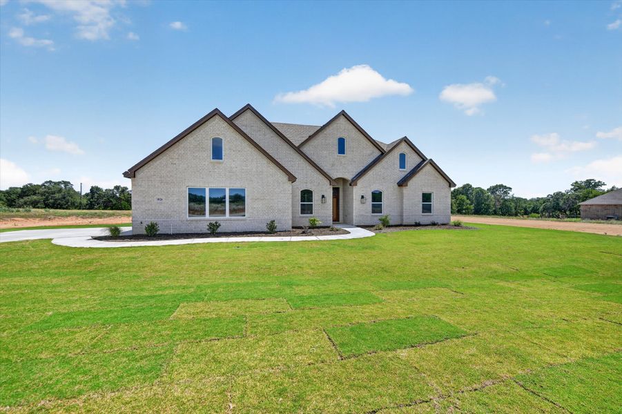 Front exterior of a new home in Taylor Ranch, Springtown, TX, highlighting curb appeal (Image 26).