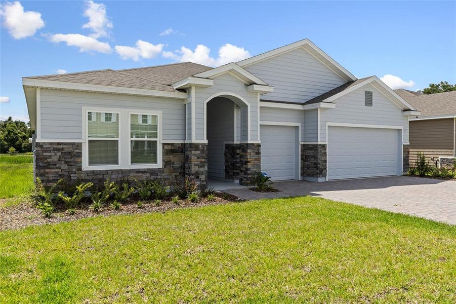 Front exterior of a new home in , Newberry, FL, highlighting curb appeal (Image 2).
