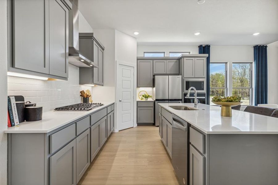 Kitchen in the Van Gogh II home plan by Trophy Signature Homes – REPRESENTATIVE PHOTO