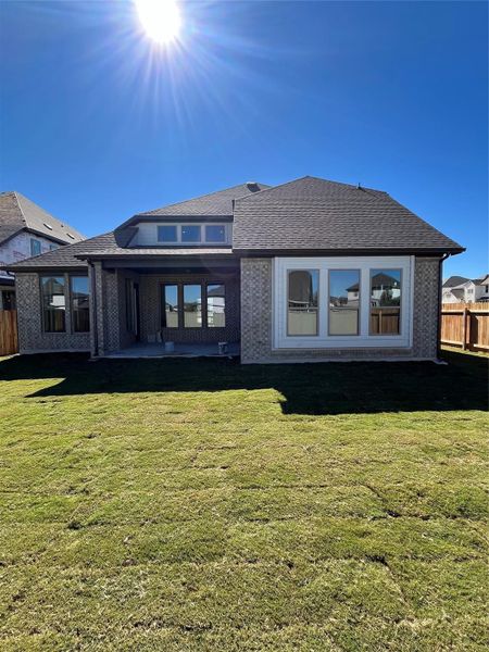 Rear of Home with Covered Patio