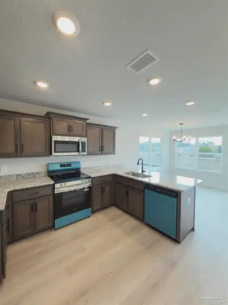 Furnished interior view inside a new home in Allison Acres, Cantonment (Image 5).