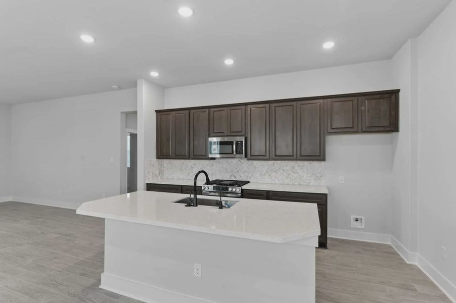 Representative furnished interior of a home built from the Charleston by Chesmar Homes in Stillwater Ranch, Buda (Image 7).