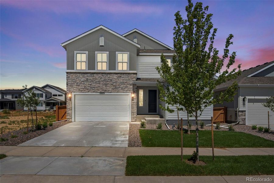 Front exterior of a new home in Reunion Ridge, Commerce City, CO, highlighting curb appeal (Image 27).