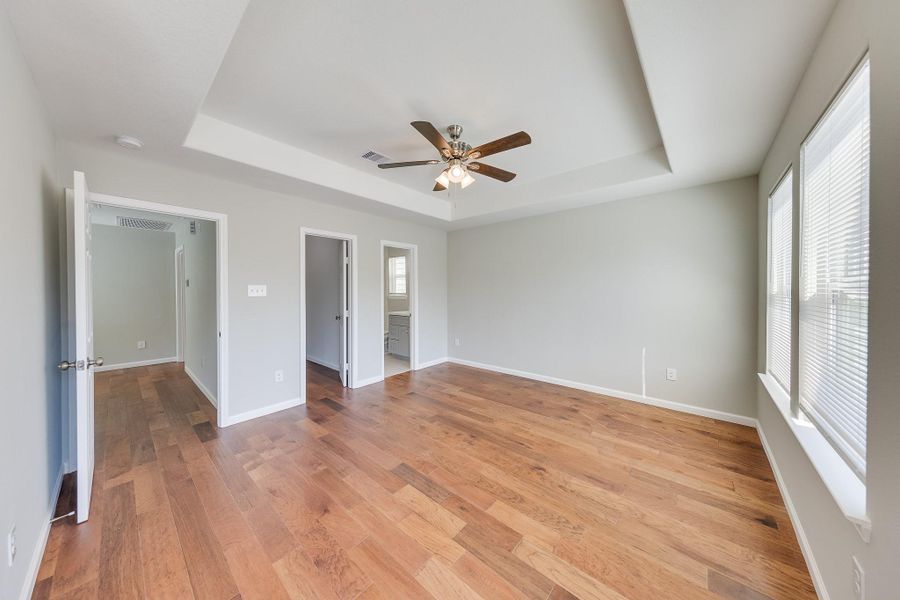 Sophisticated tray ceilings and architectural details add a touch of custom luxury and elevated style to your first home’s design.