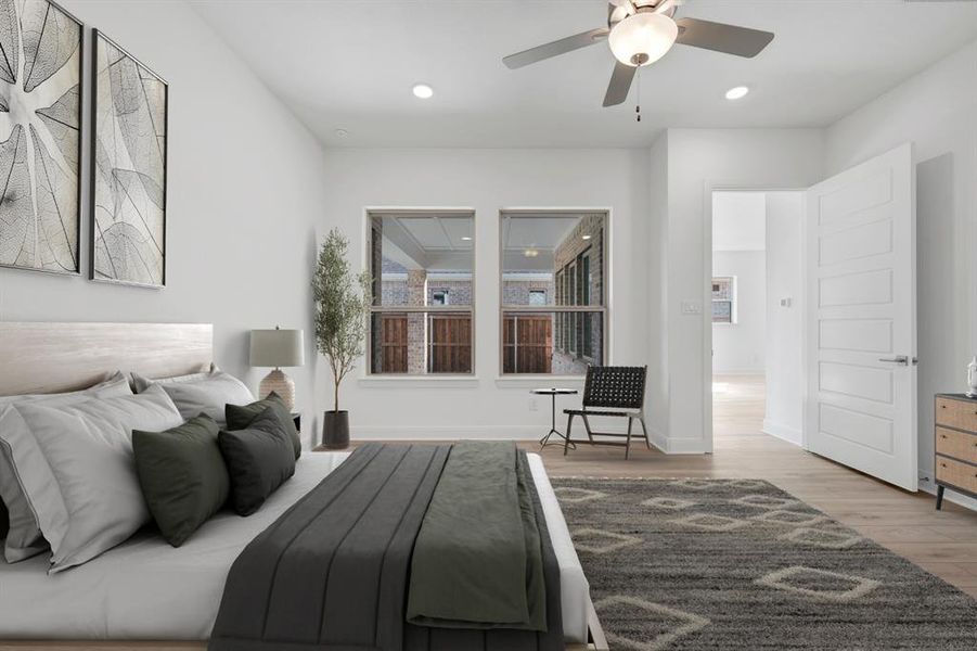 Bedroom with light wood-type flooring, a ceiling fan, and recessed lighting Bedroom with light wood-type flooring, a ceiling fan, and recessed lighting
