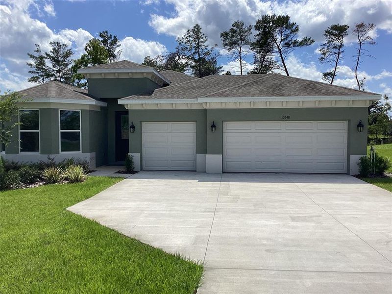 Front exterior of a new home in , Ocala, FL, highlighting curb appeal (Image 25).