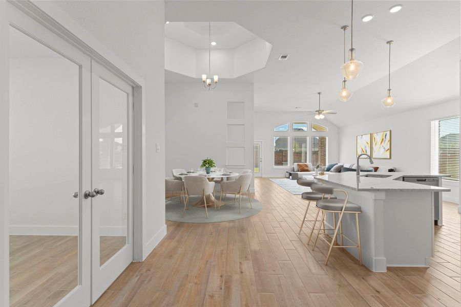Heading into the main living area notice the French Glass door leading to your home office. *Virtually Staged*Simply stunning!