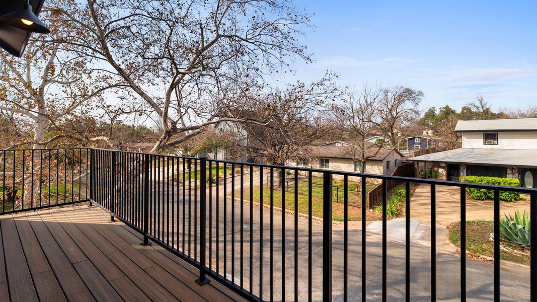 Wooden deck with a residential view