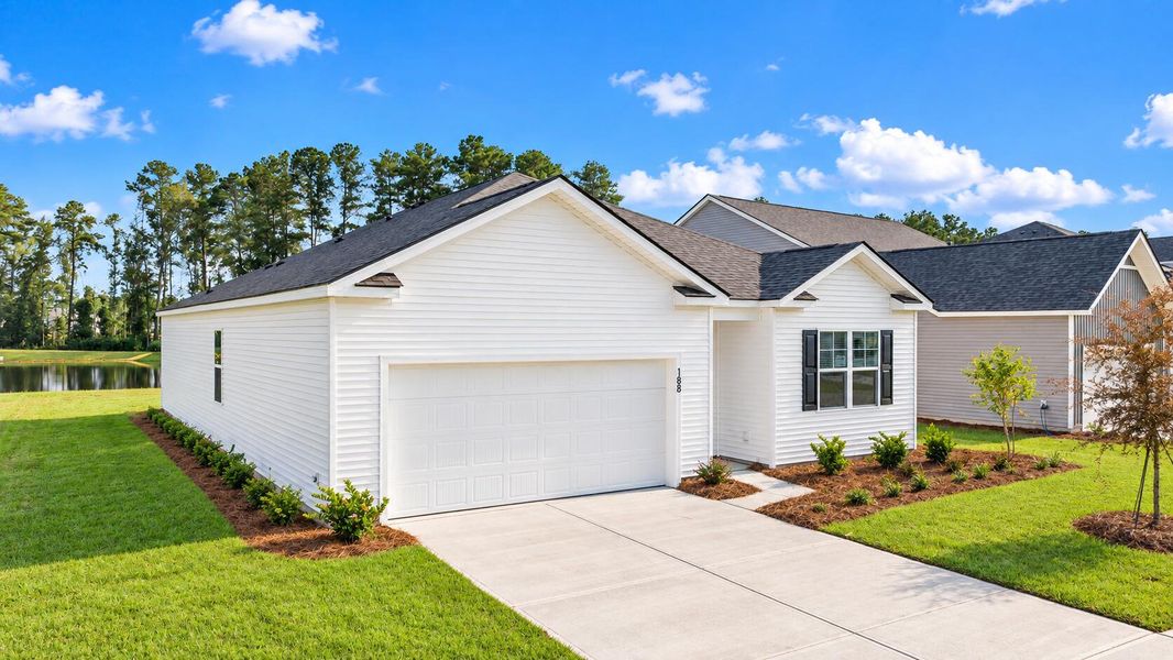 Front exterior of a new home in Pine Hills at Cane Bay, Summerville, SC, highlighting curb appeal (Image 2).