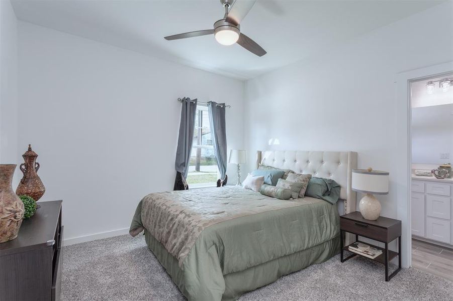 Bedroom with light wood-type flooring and ceiling fan