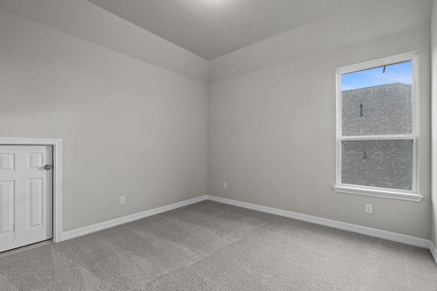 Your secondary bedroom features plush carpet, fresh paint, closet, and a large window that lets in plenty of natural lighting.