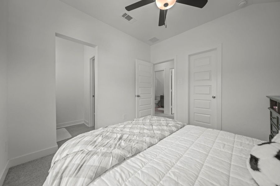 Secondary bedroom with neutral tones and easy access to the jack and Jill bath. Secondary bedroom with neutral tones and easy access to the jack and Jill bath.