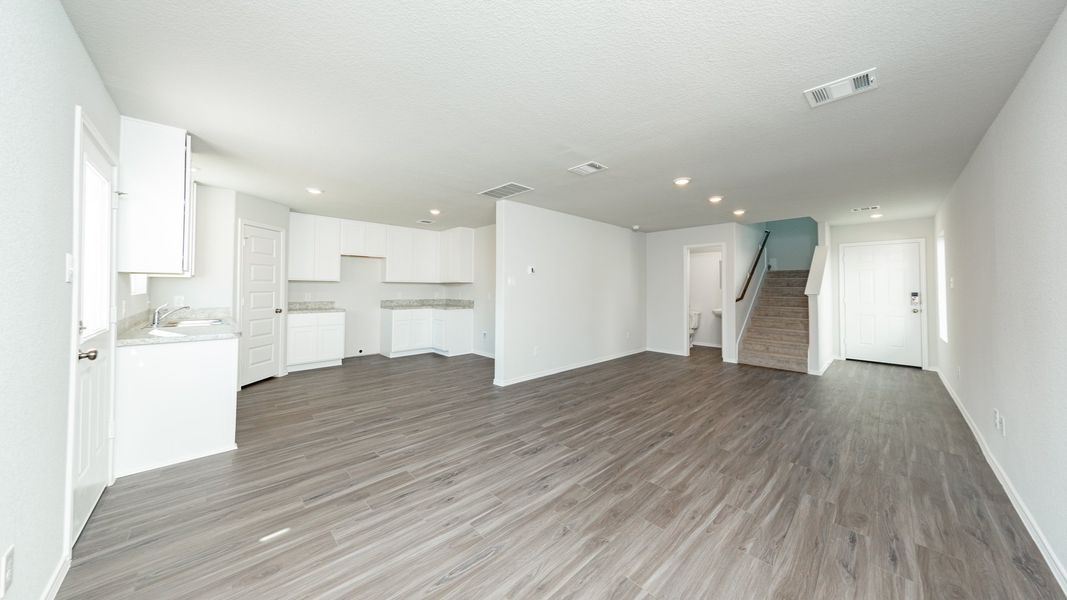 Dining Area to Kitchen and Family Room Dining Area to Kitchen and Family Room