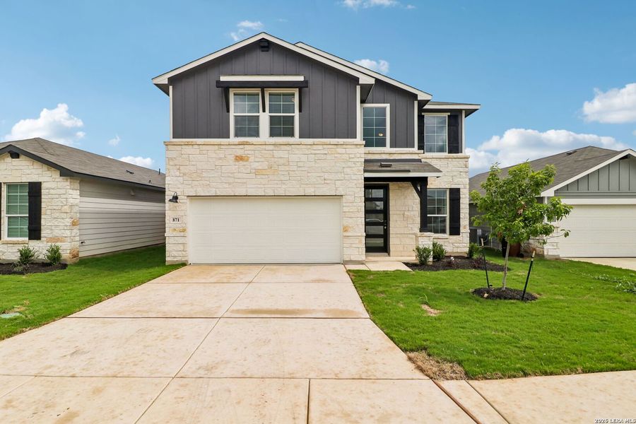 Front exterior of a new home in Estancia Ranch - Premier Series, San Antonio, TX, highlighting curb appeal (Image 24). Front exterior of a new home in Estancia Ranch - Premier Series, San Antonio, TX, highlighting curb appeal (Image 24).