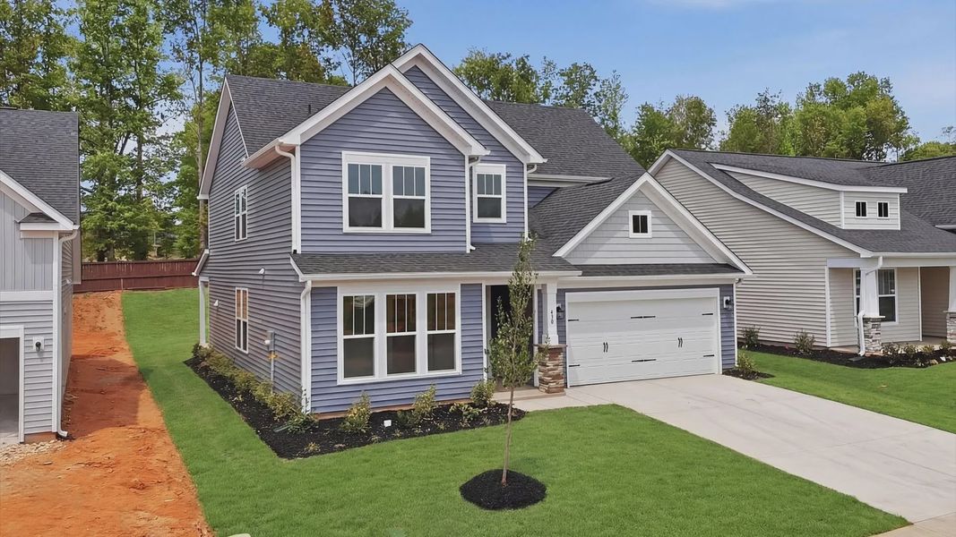 Front exterior of a new home in The Reserve at Livingston Park, Easley, SC, highlighting curb appeal (Image 20).