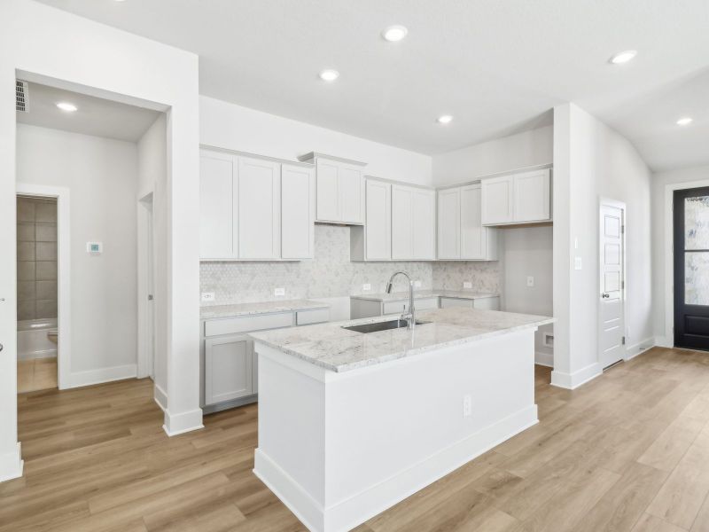 Kitchen in the San Saba floorplan at a Meritage Homes community.