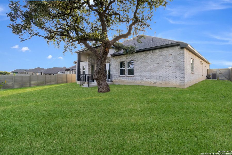 Front exterior of a new home in The Grove at Vintage Oaks, New Braunfels, TX, highlighting curb appeal (Image 16).