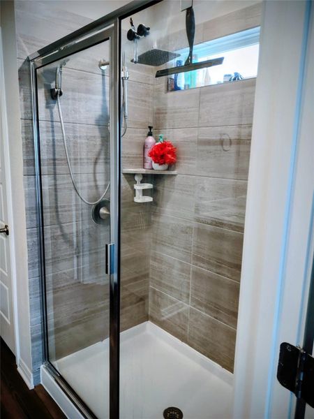 Full bathroom with a stall shower