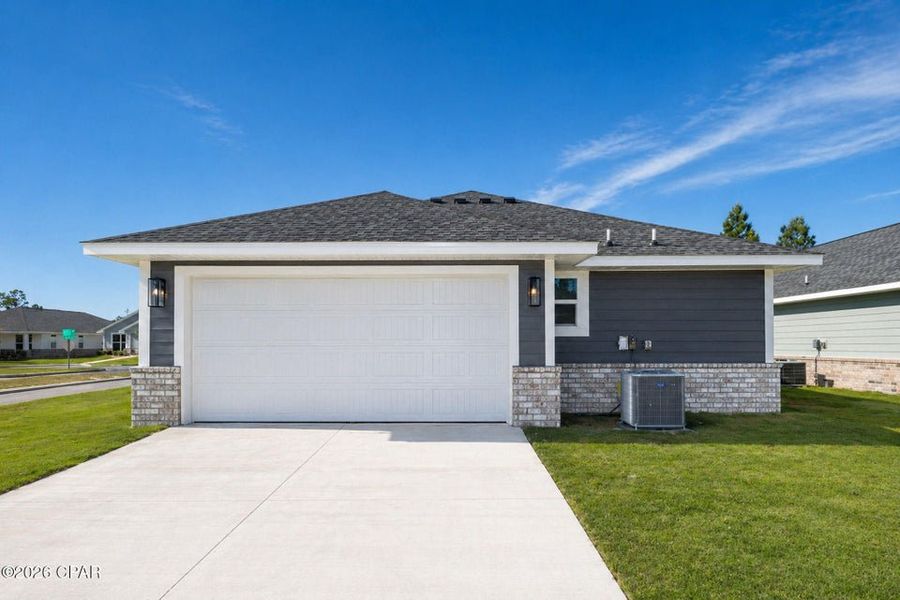 Front exterior of a new home in East Bay, Panama City, FL, highlighting curb appeal (Image 16). Front exterior of a new home in East Bay, Panama City, FL, highlighting curb appeal (Image 16).