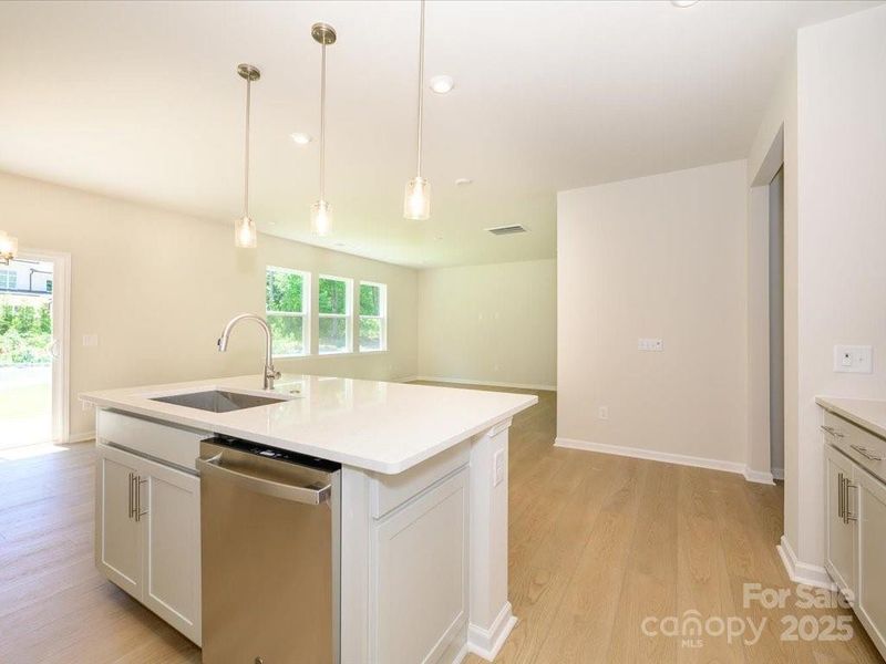 The centerpiece, a large kitchen island to gather around with family and friends. The centerpiece, a large kitchen island to gather around with family and friends.