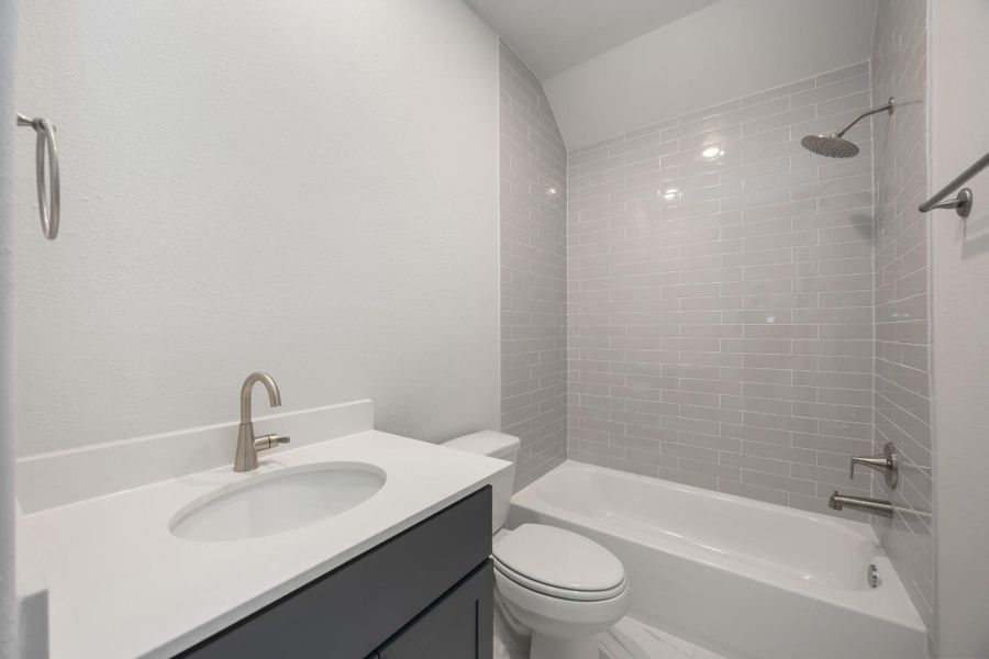 Classic Vibes: The chic Secondary Bath, nestled between the secondary bedrooms, offers a stylish and contemporary touch to your abode. Classic Vibes: The chic Secondary Bath, nestled between the secondary bedrooms, offers a stylish and contemporary touch to your abode.