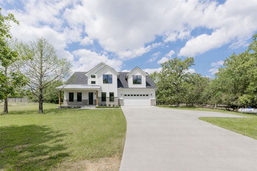 Front exterior of a new home in , College Station, TX, highlighting curb appeal (Image 2). Front exterior of a new home in , College Station, TX, highlighting curb appeal (Image 2).