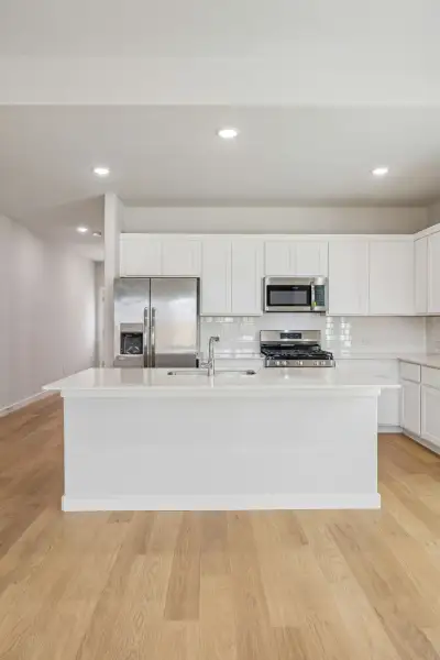 Kitchen in the Stanley II home plan by Trophy Signature Homes – REPRESENTATIVE PHOTO Kitchen in the Stanley II home plan by Trophy Signature Homes – REPRESENTATIVE PHOTO