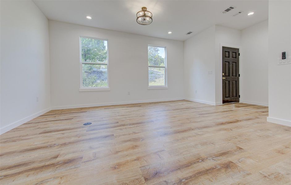 Spare room featuring recessed lighting and light wood-style flooring