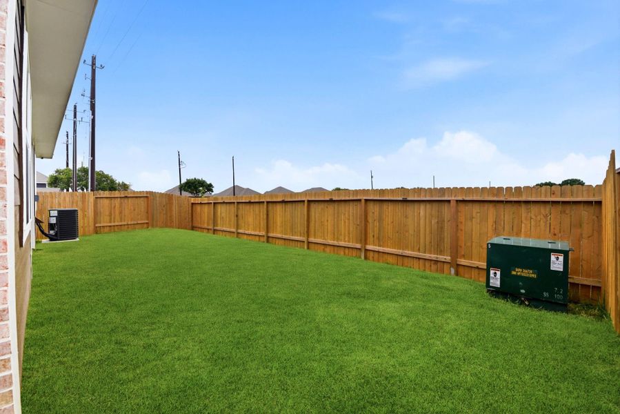 Exterior details and patio area of a home in Vacek Country Meadows, Richmond (Image 29).