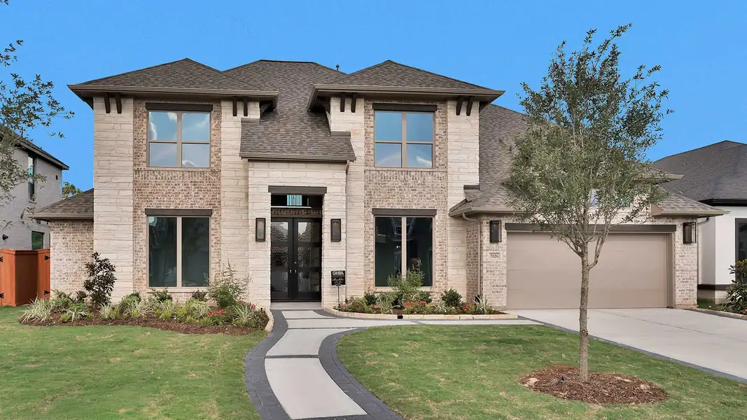 Front exterior of a new home in Elyson, Katy, TX, highlighting curb appeal (Image 1). Front exterior of a new home in Elyson, Katy, TX, highlighting curb appeal (Image 1).
