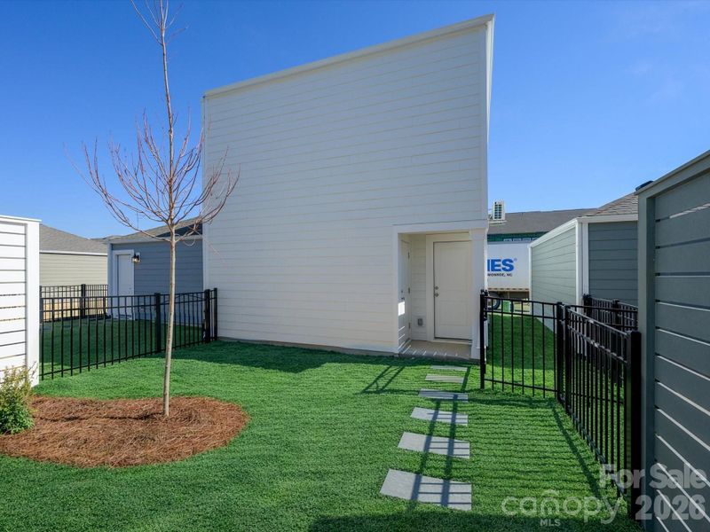 Exterior details and patio area of a home in North Creek Village, Huntersville (Image 24).