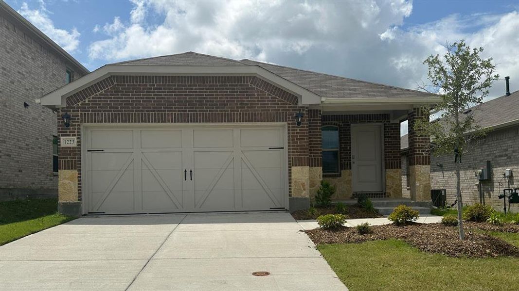 Ranch-style home featuring brick siding, driveway, a garage, and roof with shingles Ranch-style home featuring brick siding, driveway, a garage, and roof with shingles