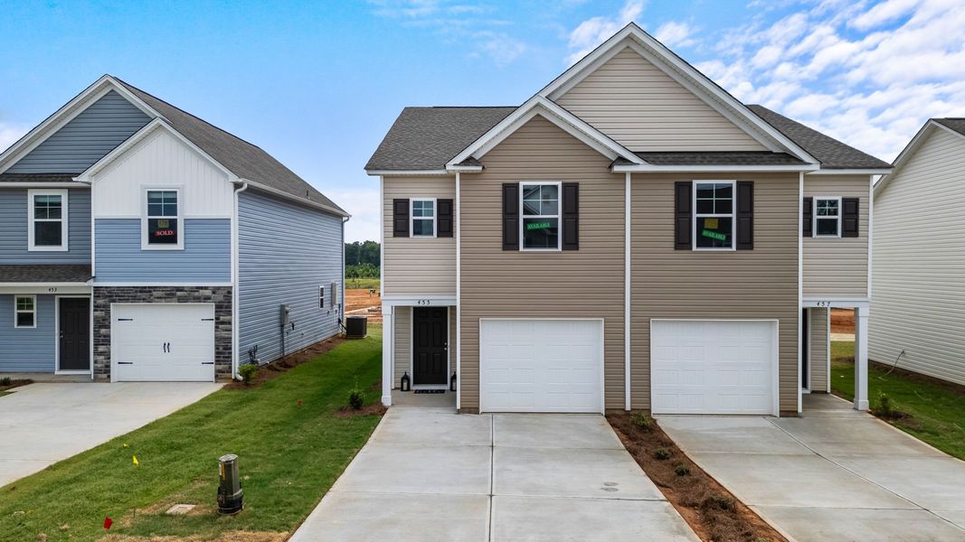 Front exterior of a new home in Champions Village at Cherry Hill, Pendleton, SC, highlighting curb appeal (Image 30).