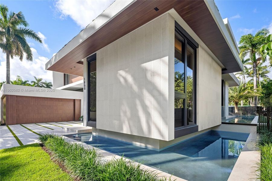 Exterior details and patio area of a home in , Miami Beach (Image 21). Exterior details and patio area of a home in , Miami Beach (Image 21).