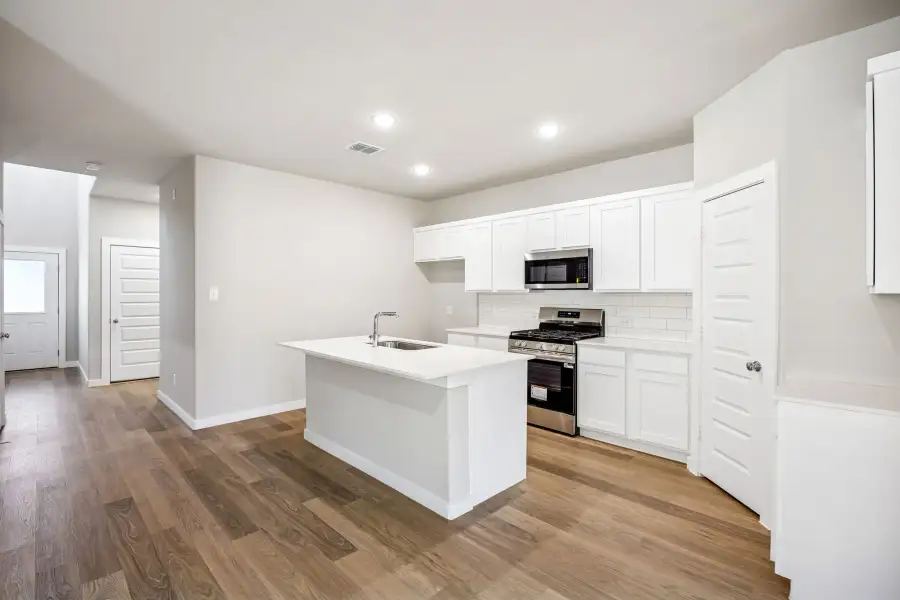Kitchen in the Willow home plan by Trophy Signature Homes – REPRESENTATIVE PHOTO Kitchen in the Willow home plan by Trophy Signature Homes – REPRESENTATIVE PHOTO