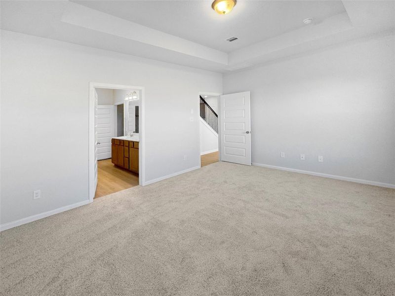 The Waring III-Primary Suite, Tray Ceiling not included. Under construction, options, upgrades and colors will vary.