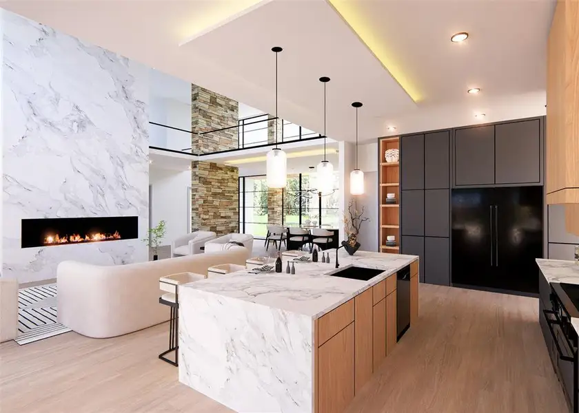 Kitchen with a large island, black appliances, a high end fireplace, and light hardwood / wood-style flooring