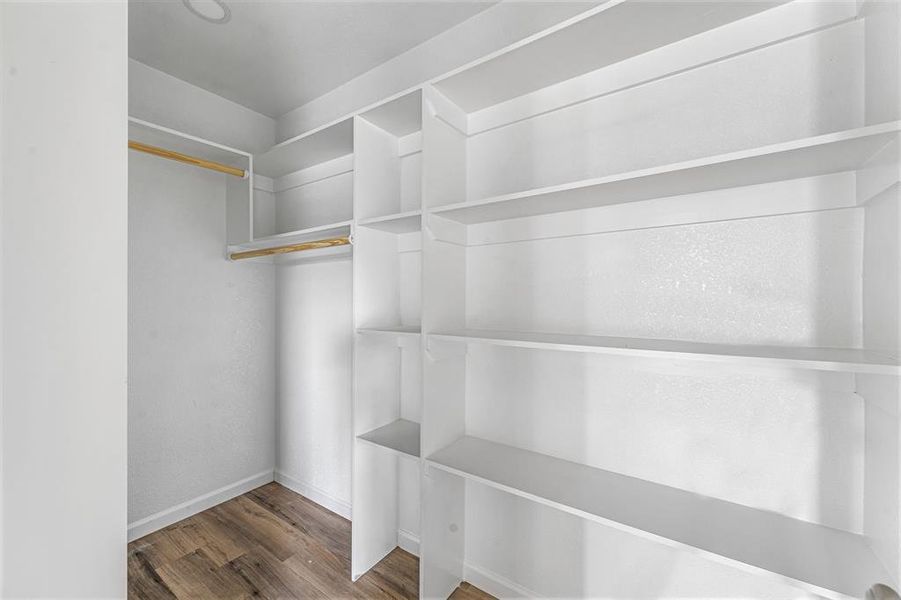 Spacious closet featuring wood finished floors Spacious closet featuring wood finished floors