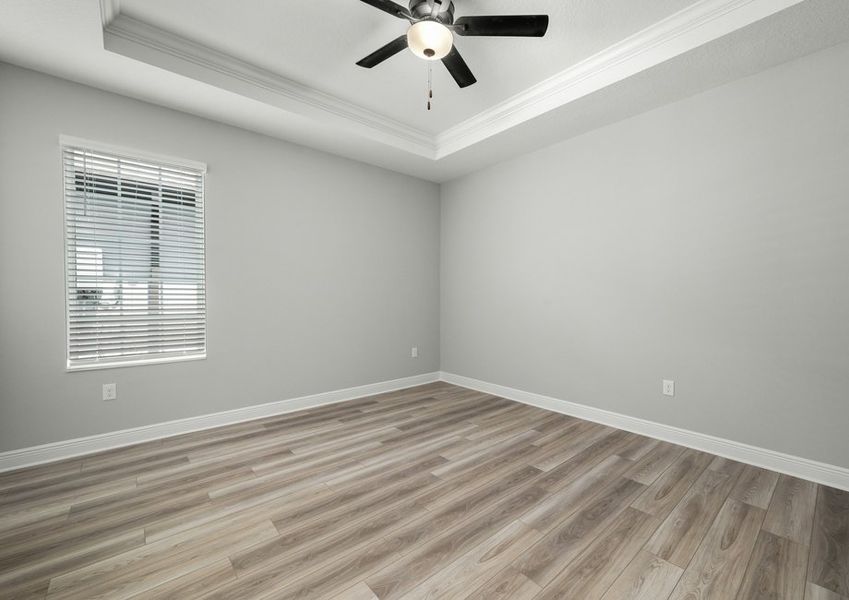 Master bedroom with a ceiling fan
