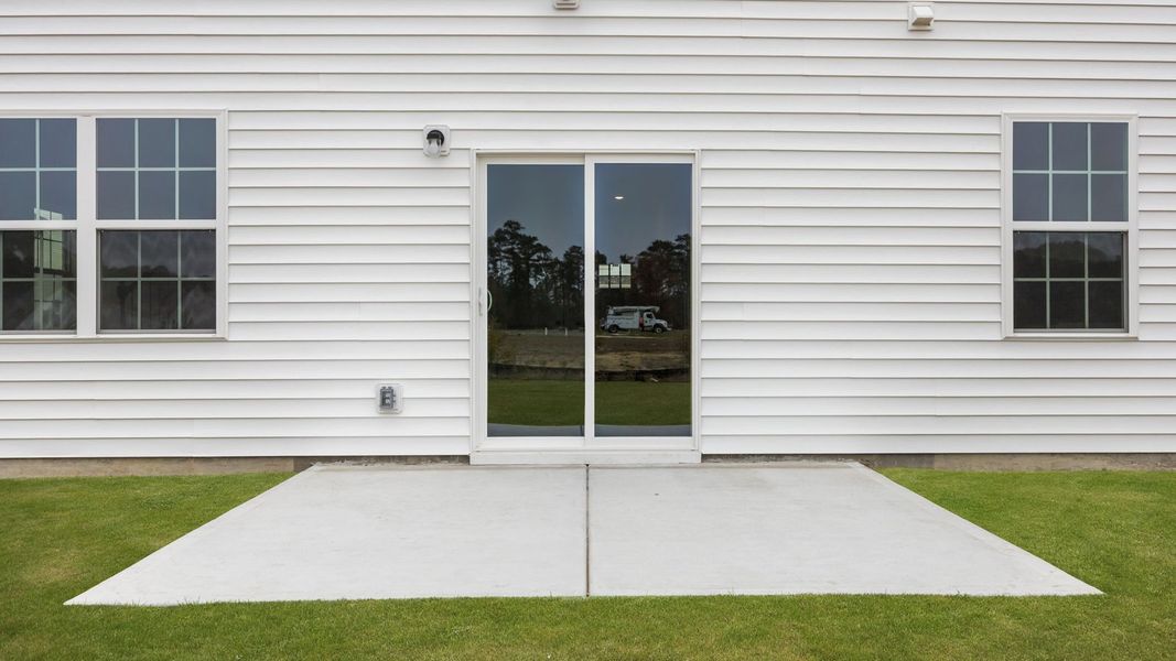 Exterior details and patio area of a home in Ridgewood Farms, Winterville (Image 20).