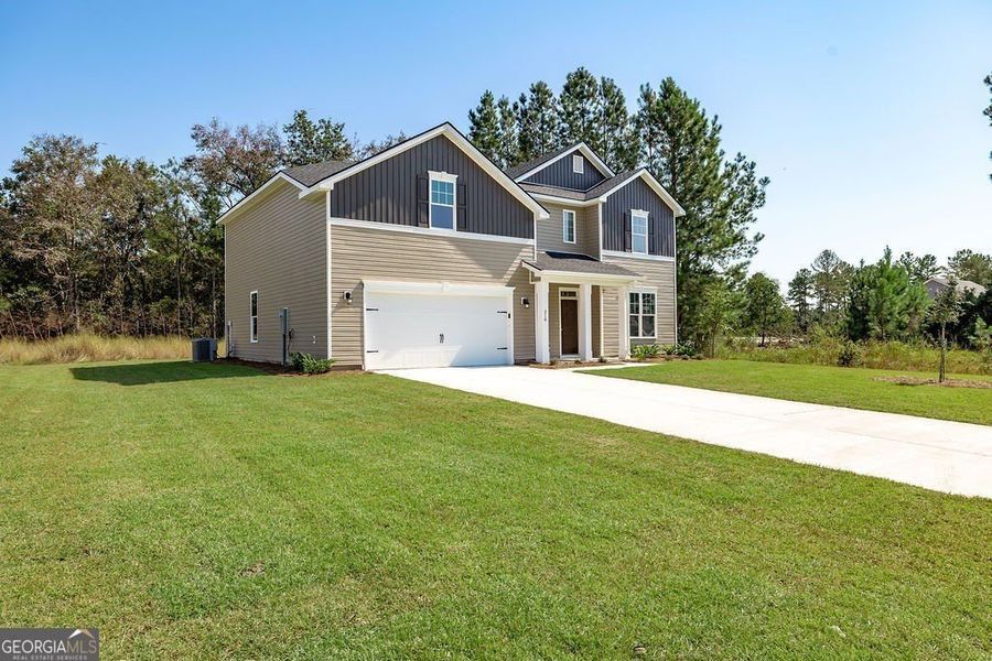Front exterior of a new home in NorthShore on the St. Marys River, Kingsland, GA, highlighting curb appeal (Image 26).