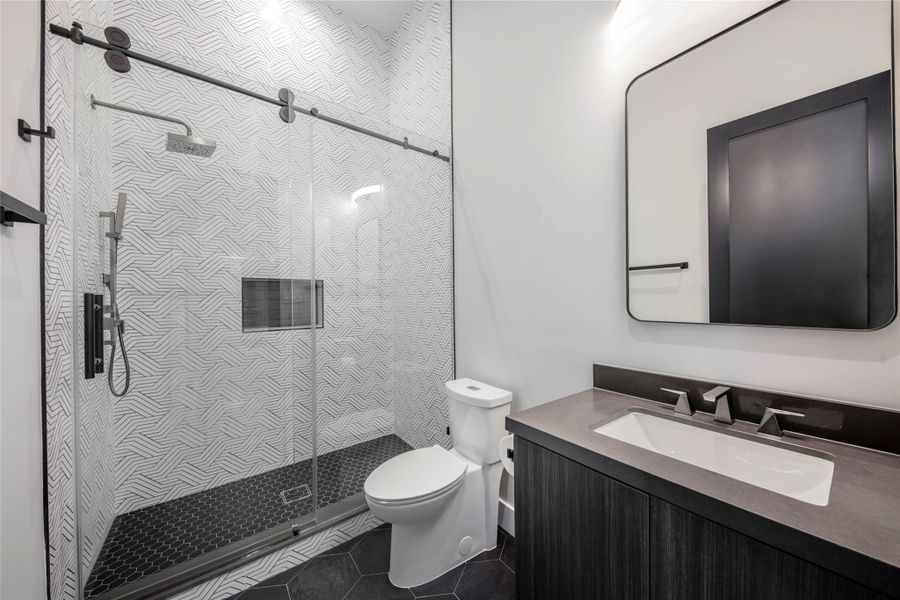 Example of Builders previously built home with similar finishes. Secondary bathroom showcasing a unique style, blending design creativity with functional elegance. Example of Builders previously built home with similar finishes. Secondary bathroom showcasing a unique style, blending design creativity with functional elegance.