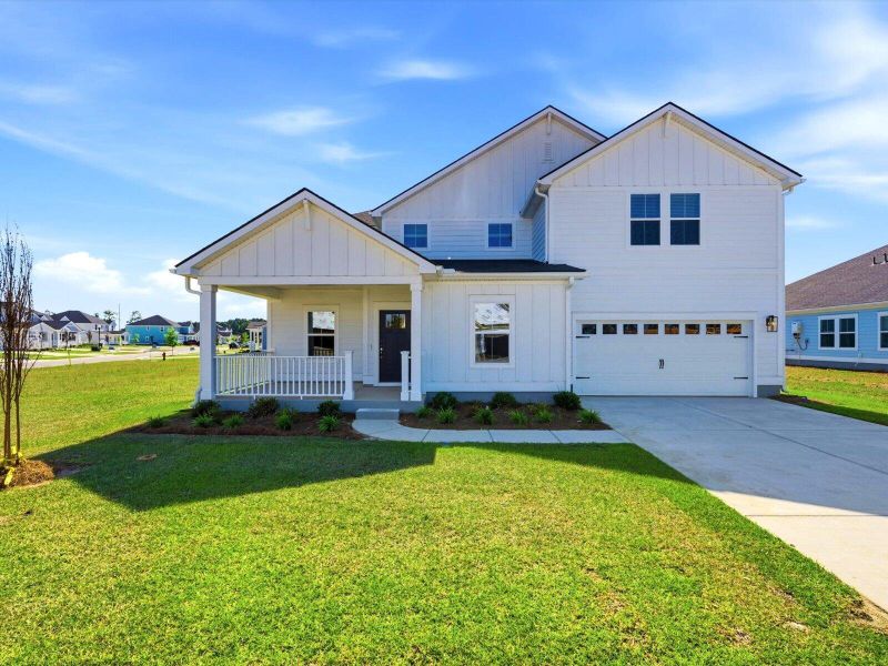 Front exterior of a new home in The Coves at Lakes of Cane Bay II, Summerville, SC, highlighting curb appeal (Image 1). Front exterior of a new home in The Coves at Lakes of Cane Bay II, Summerville, SC, highlighting curb appeal (Image 1).