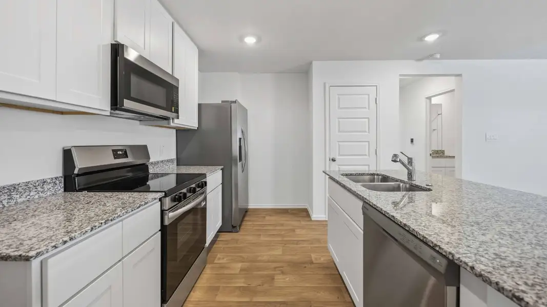 Furnished interior view inside a new home in Legacy Village, Houston (Image 3).