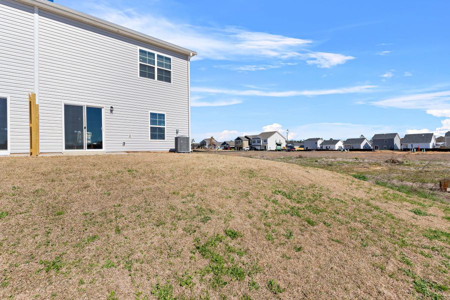 Representative exterior photo of a completed home built from the Balsa by McGuinn Homes in Sibley Village Townhomes, Sumter, SC (Image 34).